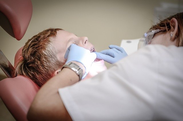 Dentist attending a Child at Schaefer Dental Group Okemos